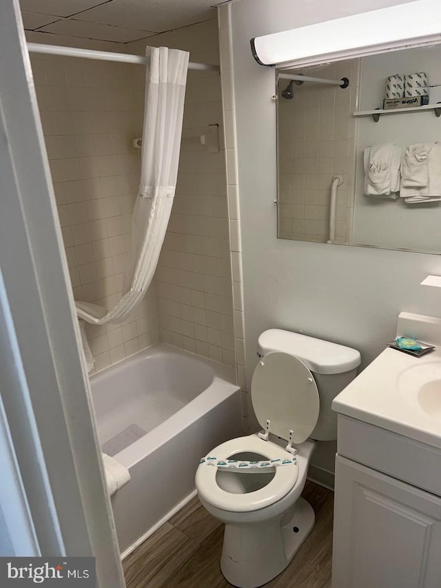 full bathroom with shower / bath combination with curtain, toilet, and vanity