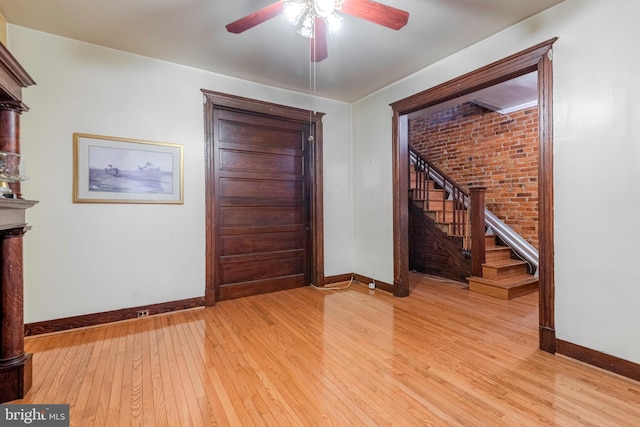 entryway with ceiling fan and light wood-type flooring