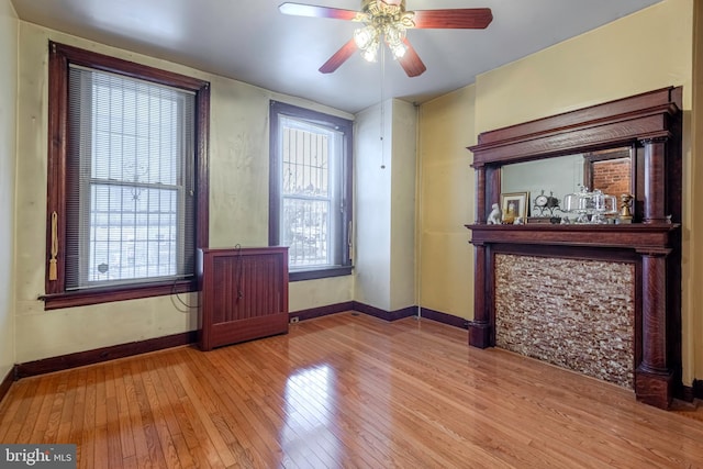 spare room featuring ceiling fan and light wood-type flooring