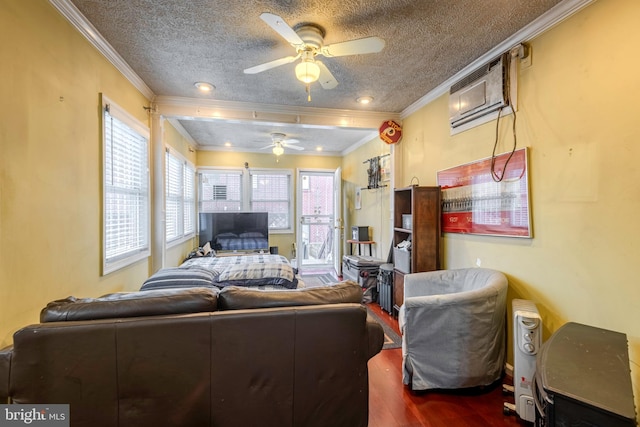 living room featuring ceiling fan, a wall mounted AC, a textured ceiling, crown molding, and dark hardwood / wood-style floors