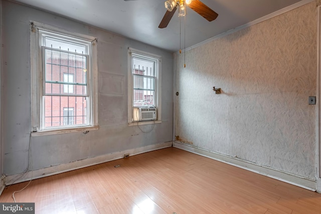 spare room with ceiling fan and light hardwood / wood-style flooring