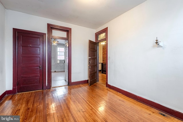 unfurnished bedroom with light wood-type flooring