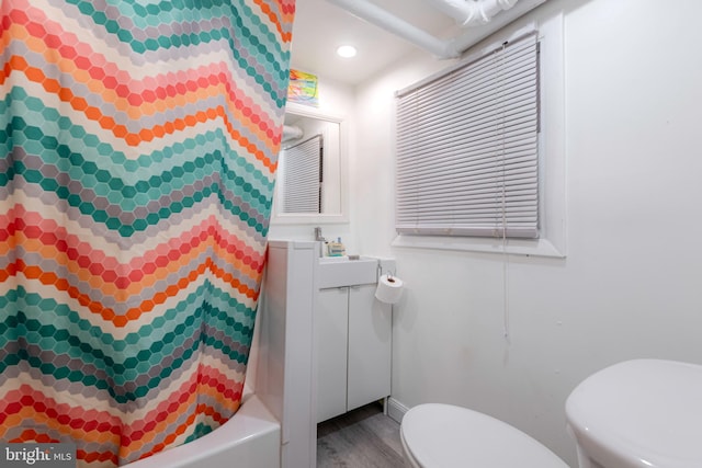 bathroom featuring toilet and hardwood / wood-style floors