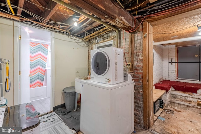 clothes washing area featuring washer / clothes dryer