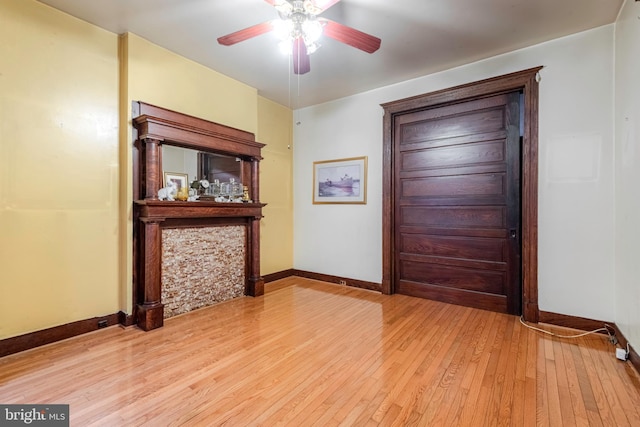 entrance foyer with ceiling fan and light wood-type flooring