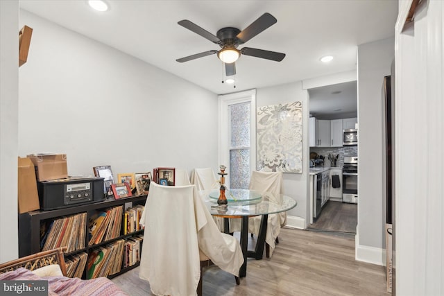 dining area featuring ceiling fan and light hardwood / wood-style floors