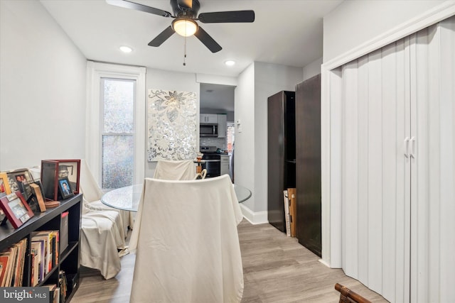 interior space featuring ceiling fan and light hardwood / wood-style floors