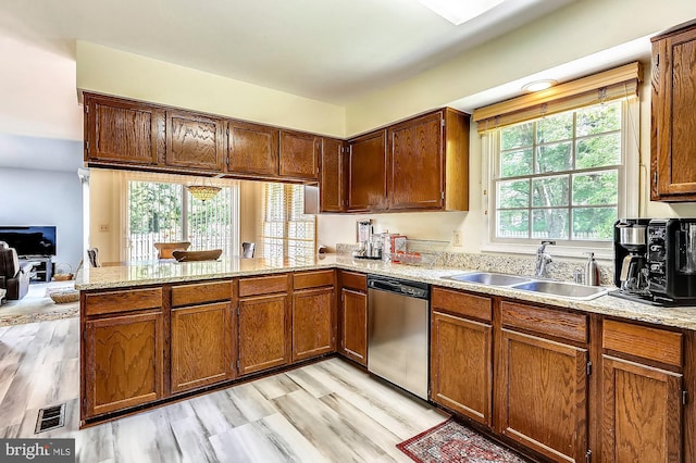 kitchen with sink, light hardwood / wood-style flooring, kitchen peninsula, and dishwasher