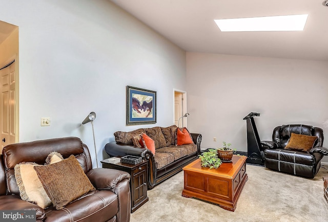 living room featuring light colored carpet and lofted ceiling with skylight