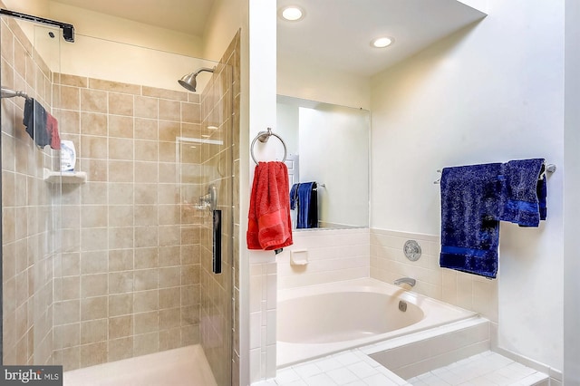 bathroom with shower with separate bathtub