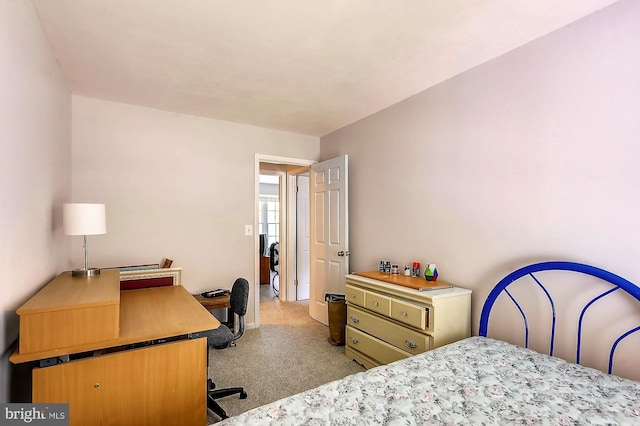 bedroom with light colored carpet