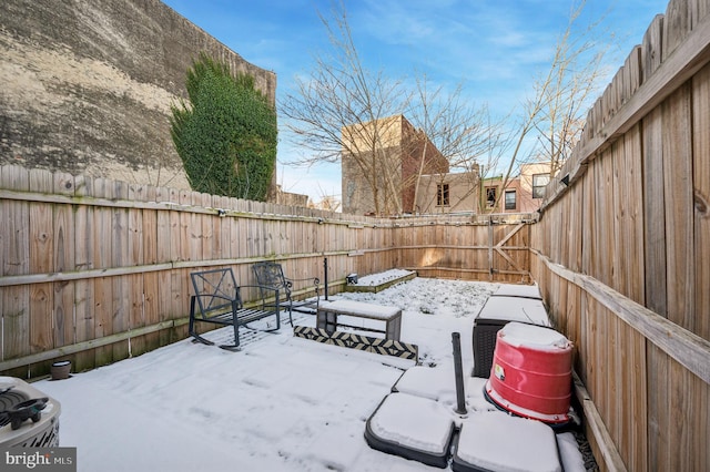 view of yard layered in snow