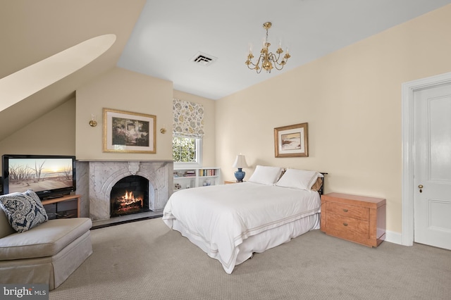 carpeted bedroom with a notable chandelier, a high end fireplace, and lofted ceiling