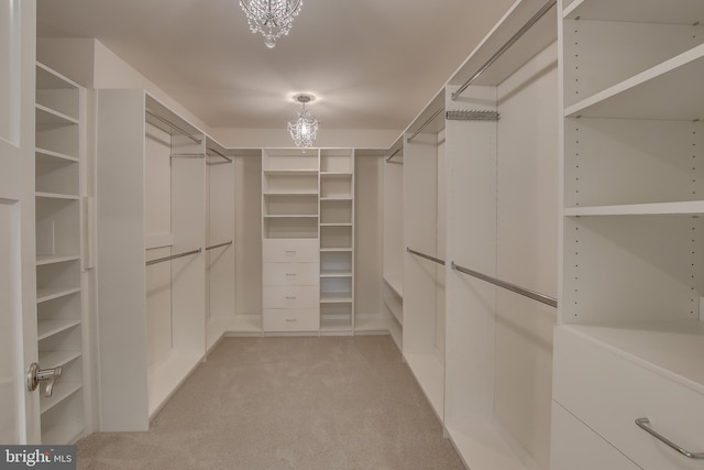 walk in closet featuring light colored carpet