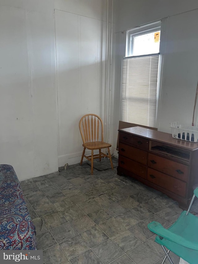 sitting room with dark tile floors