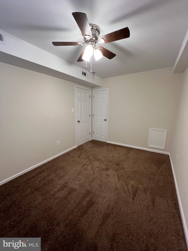 spare room with carpet floors and ceiling fan