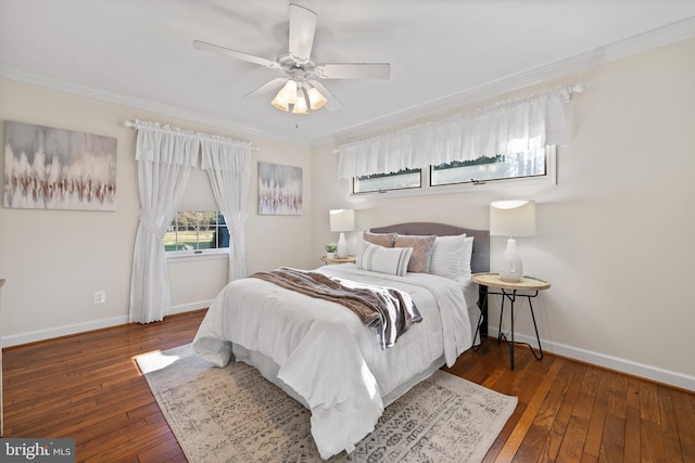 bedroom with ceiling fan, crown molding, and dark wood-type flooring