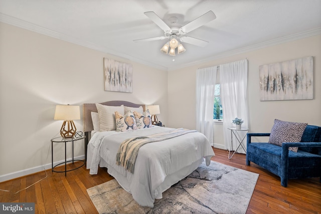 bedroom featuring ornamental molding, dark hardwood / wood-style flooring, and ceiling fan