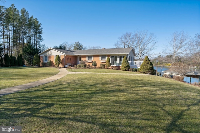 ranch-style home featuring a front yard