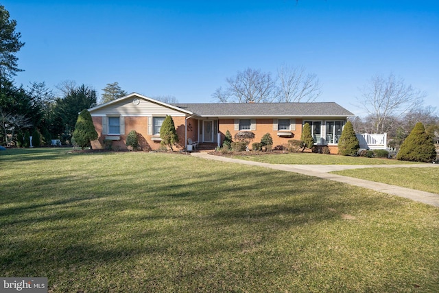 ranch-style home with a front yard