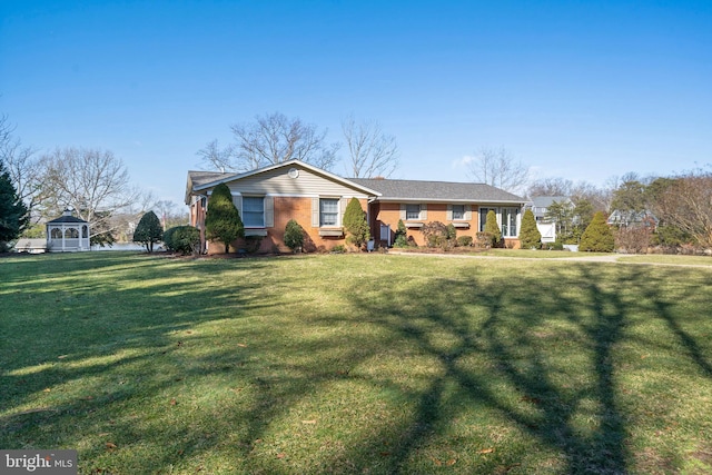 ranch-style home with a front yard