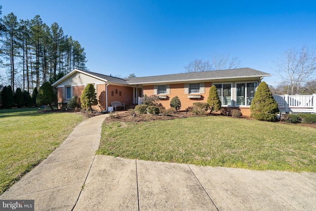 single story home with a front yard