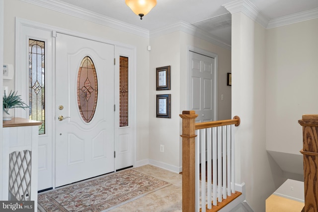 tiled entrance foyer featuring ornamental molding