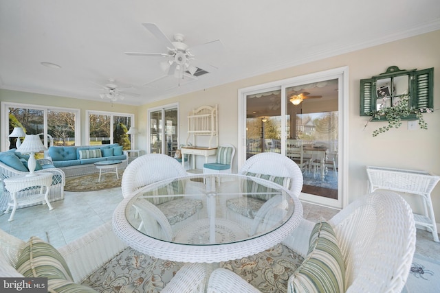 sunroom with ceiling fan