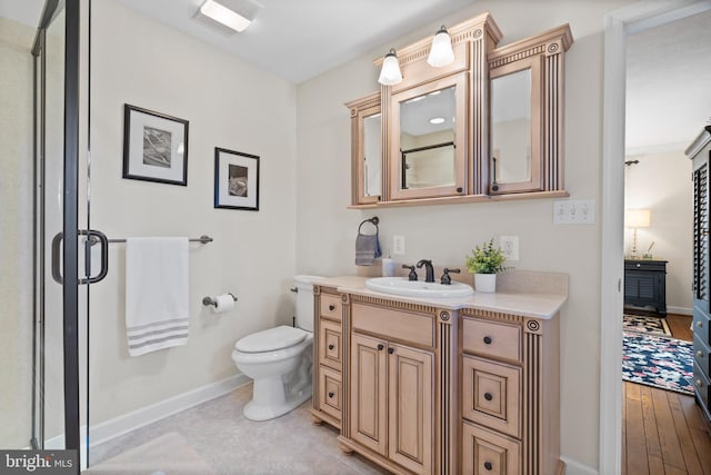 bathroom featuring walk in shower, toilet, vanity, and wood-type flooring