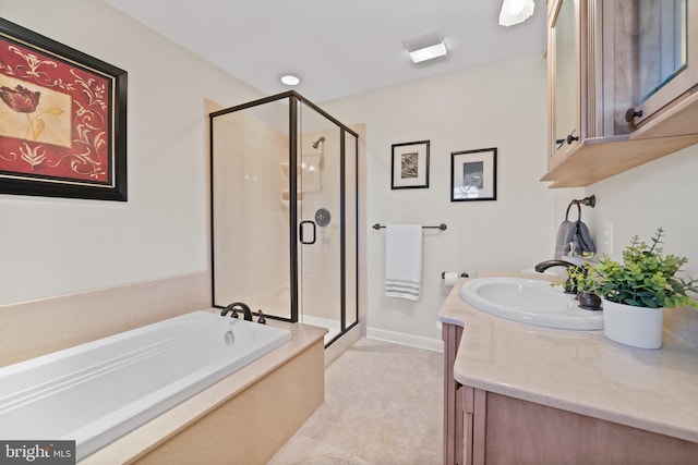 bathroom with tile flooring, vanity, and independent shower and bath