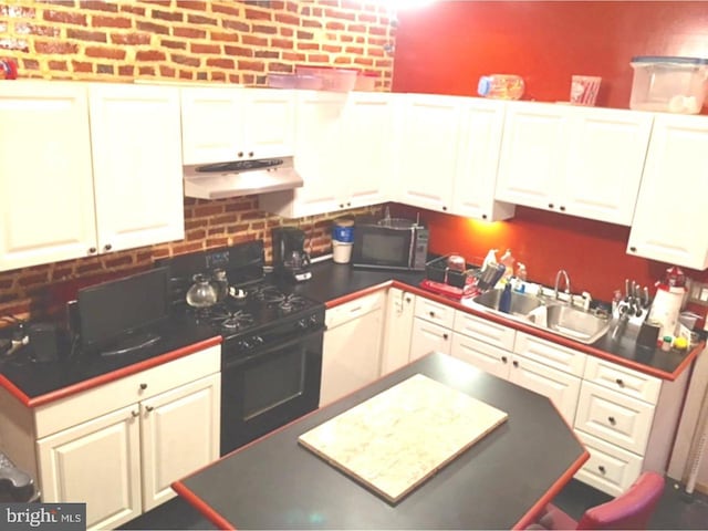 kitchen featuring white cabinets, backsplash, sink, and black appliances