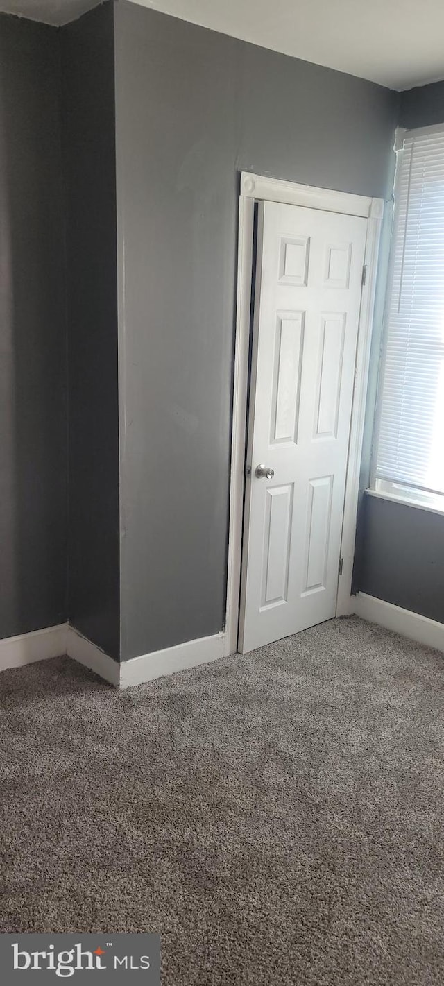 empty room with carpet flooring