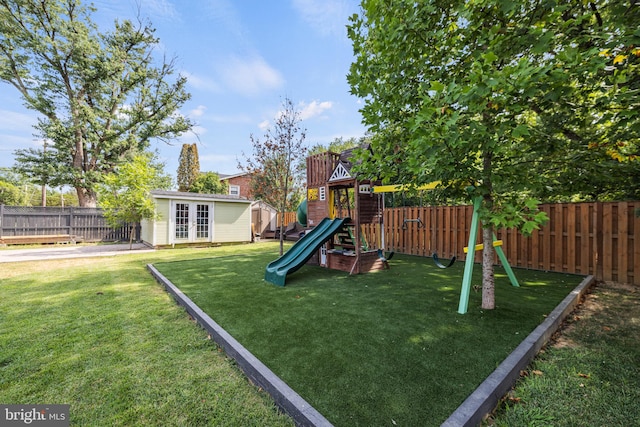 view of playground featuring french doors and a lawn