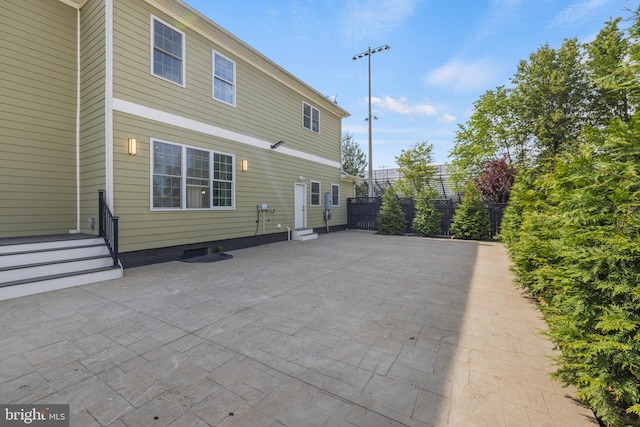 rear view of house with a patio