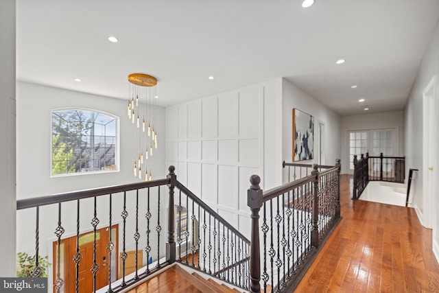 hall with wood-type flooring