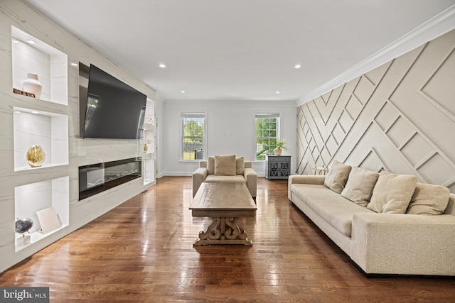 living room with ornamental molding and dark hardwood / wood-style floors