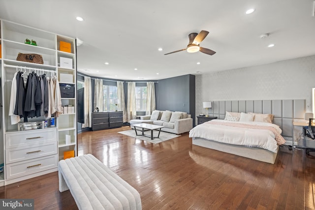 bedroom featuring wood-type flooring, a closet, and ceiling fan