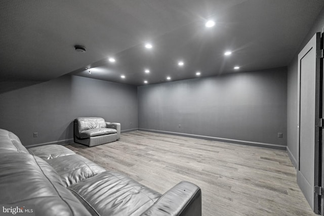 home theater room featuring light hardwood / wood-style flooring