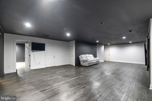 basement with dark hardwood / wood-style flooring