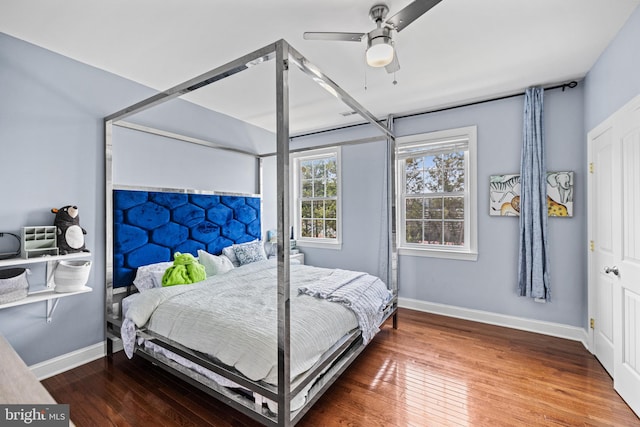 bedroom with hardwood / wood-style floors and ceiling fan