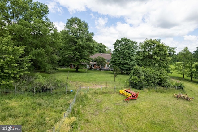 view of yard with a rural view