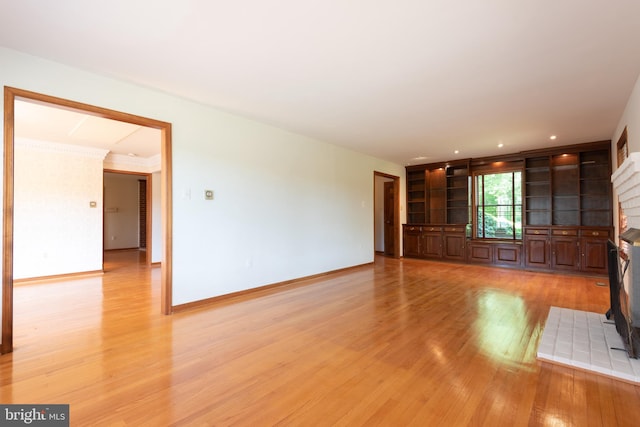 unfurnished living room with light hardwood / wood-style floors