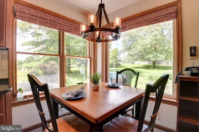 dining area featuring an inviting chandelier