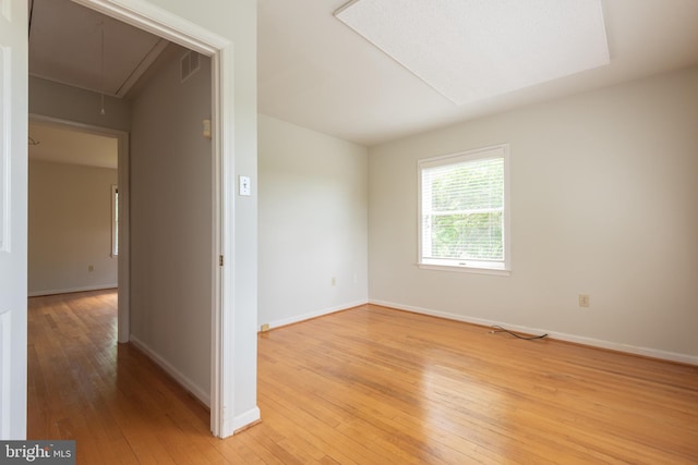 unfurnished room with light hardwood / wood-style flooring