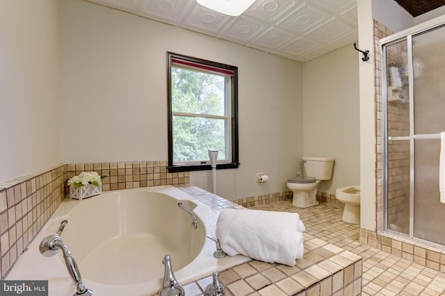 bathroom with a bidet, tile flooring, plus walk in shower, and toilet