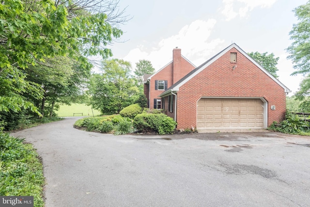 view of home's exterior with a garage