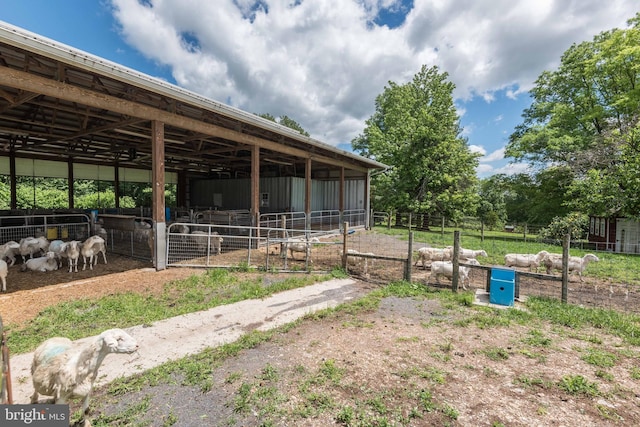 view of horse barn with an outdoor structure