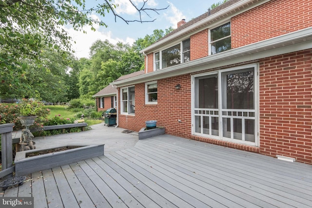 wooden terrace with grilling area