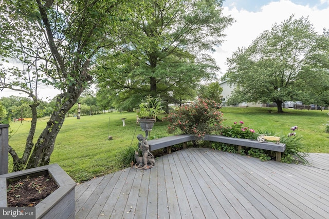 deck featuring a lawn