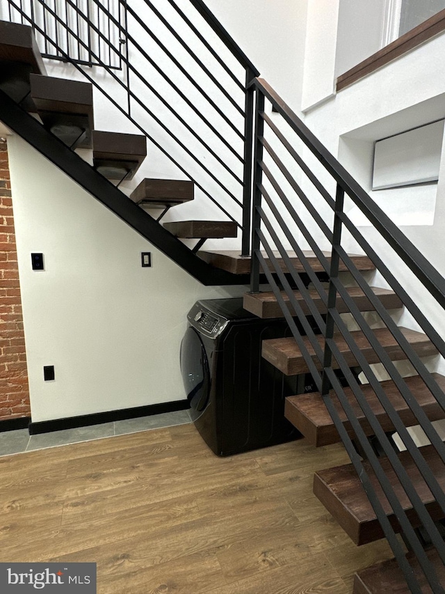 stairs featuring wood-type flooring